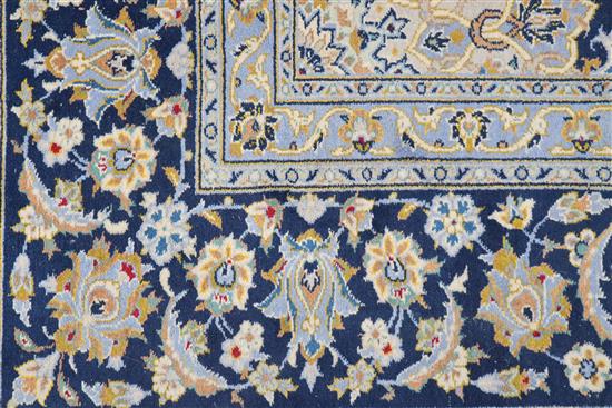 A Tabriz style blue ground carpet 388 x 279cm